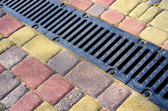 Brick walkway with drainage grate